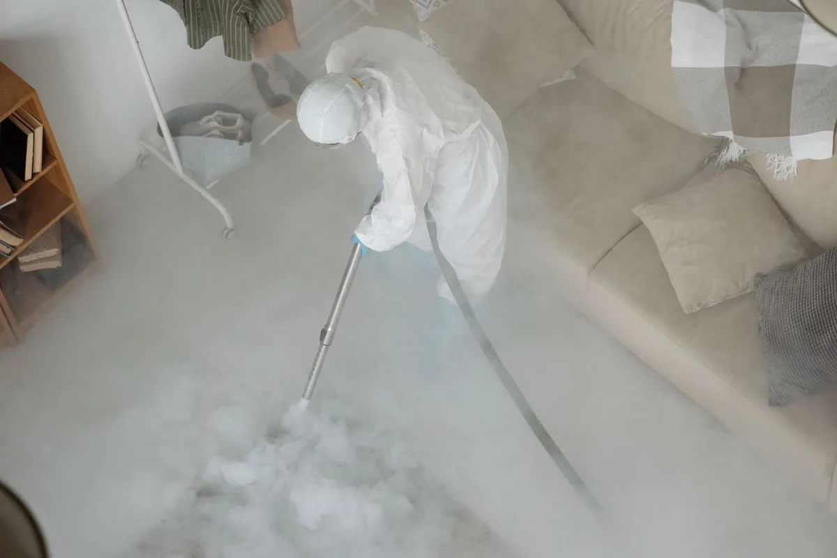 Biohazard cleanup technician in protective equipment, Chelsea, MI
